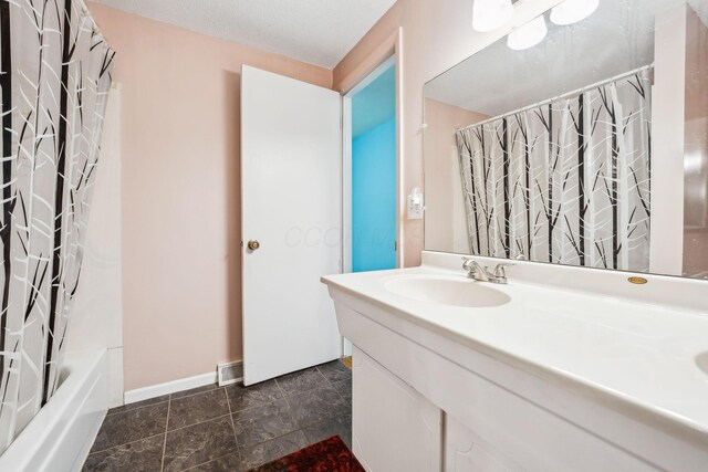 4750 Manitoba Ct, Columbus, OH 43229 - bathroom with vanity and shower / tub combo with curtain
