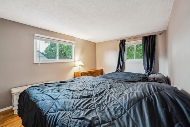 4750 Manitoba Ct, Columbus, OH 43229 - bedroom with wood finished floors and a textured ceiling