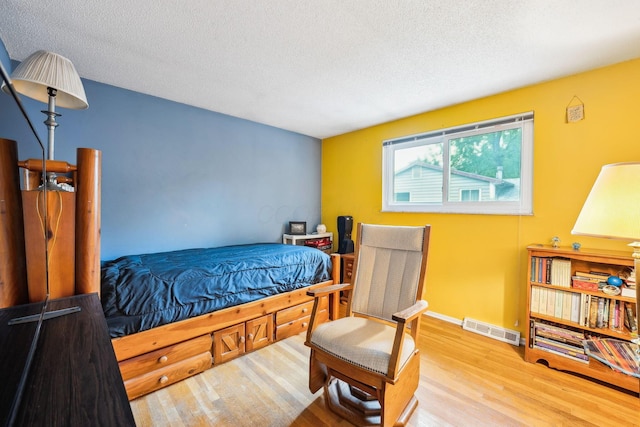 4750 Manitoba Ct, Columbus, OH 43229 - bedroom featuring wood finished floors and a textured ceiling