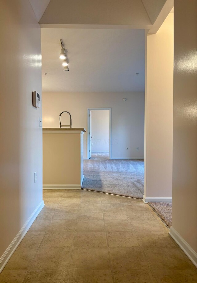 3839 Carberry Dr, Dublin, OH 43016 - corridor featuring rail lighting and baseboards