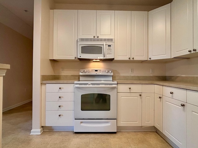 3839 Carberry Dr, Dublin, OH 43016 - kitchen featuring white appliances, white cabinets, and light countertops