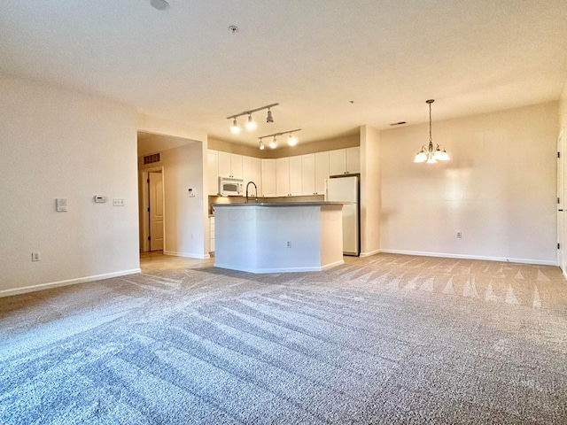 3839 Carberry Dr, Dublin, OH 43016 - kitchen featuring white appliances, open floor plan, light carpet, and white cabinetry
