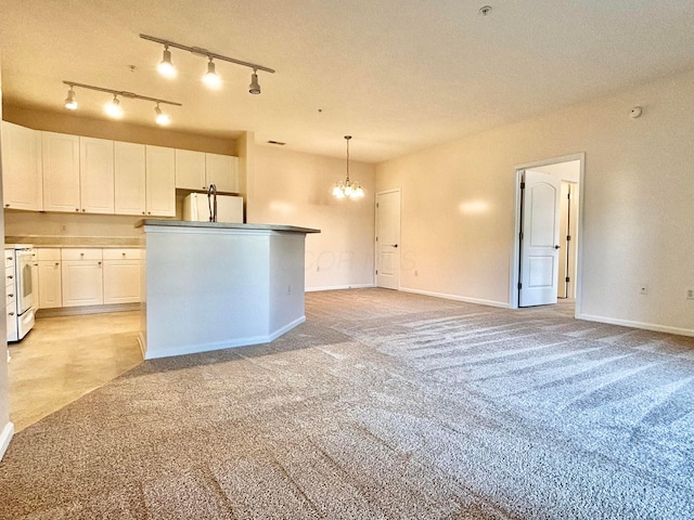 3839 Carberry Dr, Dublin, OH 43016 - kitchen with white appliances, a chandelier, white cabinetry, and light carpet