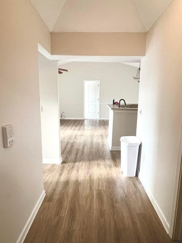 8061 Cranes Crossing Dr, Lewis Center, OH 43035 - hallway with vaulted ceiling and wood finished floors