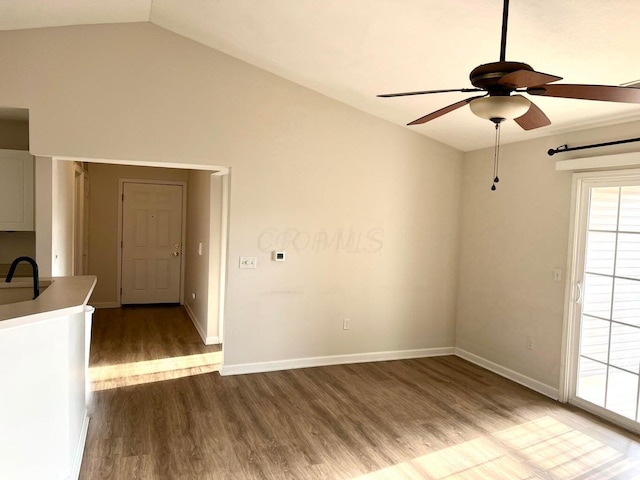 8061 Cranes Crossing Dr, Lewis Center, OH 43035 - empty room featuring a ceiling fan, dark wood-style flooring, and vaulted ceiling