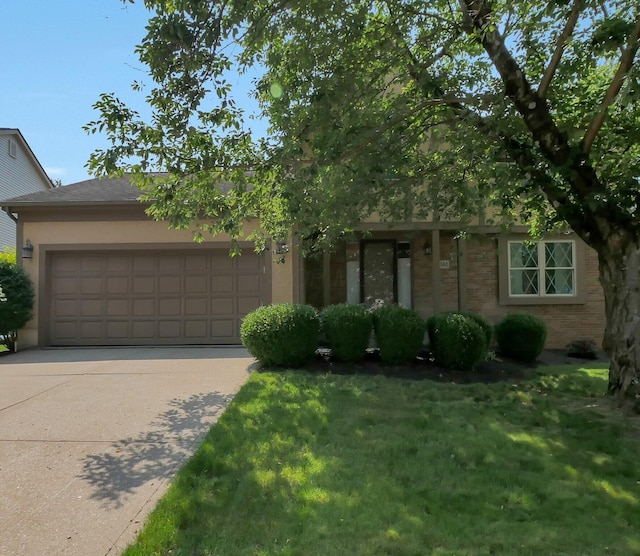 1380 Hanbury Ct, Gahanna, OH 43230 - view of front of home with a garage, driveway, a front lawn, and brick siding