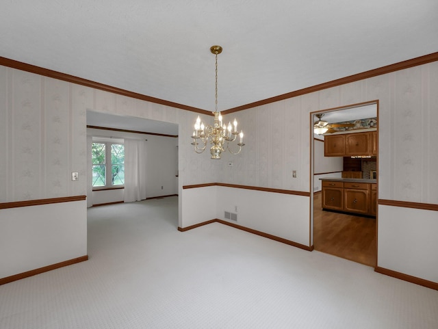 1380 Hanbury Ct, Gahanna, OH 43230 - empty room featuring a chandelier, crown molding, light carpet, and wallpapered walls