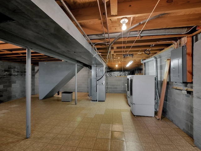 1380 Hanbury Ct, Gahanna, OH 43230 - unfinished below grade area featuring washing machine and clothes dryer, electric panel, heating unit, tile patterned floors, and stairway