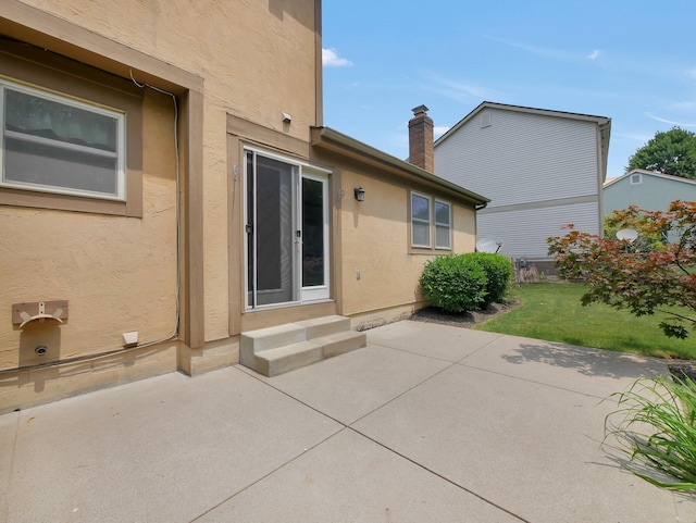 1380 Hanbury Ct, Gahanna, OH 43230 - back of house featuring a patio, stucco siding, and entry steps