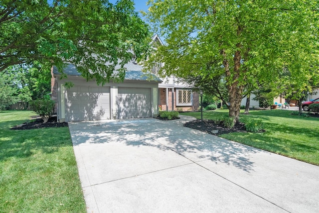 6978 Ernest Way, Dublin, OH 43017 - obstructed view of property featuring a front lawn, driveway, brick siding, and an attached garage
