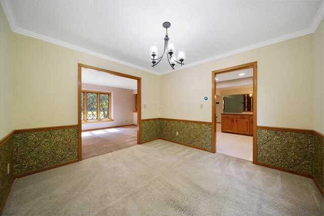 6978 Ernest Way, Dublin, OH 43017 - carpeted spare room with a chandelier, a wainscoted wall, and crown molding