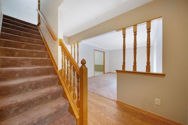 6978 Ernest Way, Dublin, OH 43017 - stairs with hardwood / wood-style floors and crown molding