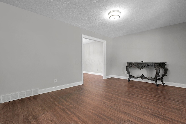 2709 Patrick Ave, Columbus, OH 43231 - empty room featuring dark wood-style flooring and a textured ceiling