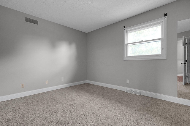2709 Patrick Ave, Columbus, OH 43231 - unfurnished room featuring carpet floors and a textured ceiling