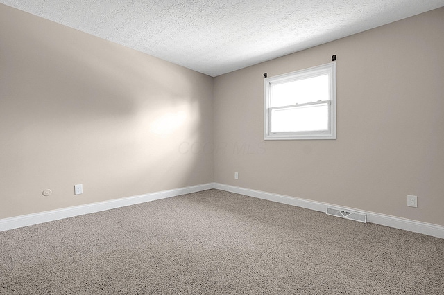 2709 Patrick Ave, Columbus, OH 43231 - carpeted spare room with baseboards and a textured ceiling