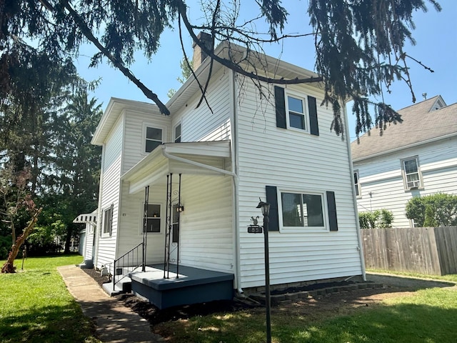 85 Blymer St, Delaware, OH 43015 - rear view of property featuring a chimney
