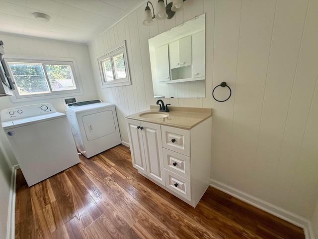85 Blymer St, Delaware, OH 43015 - laundry area with cabinet space, washing machine and clothes dryer, and dark wood-style flooring