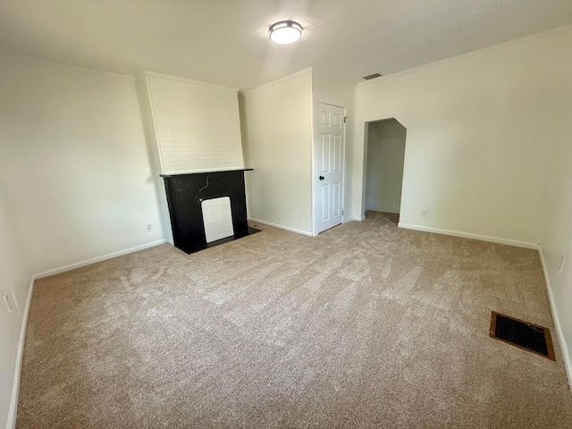 85 Blymer St, Delaware, OH 43015 - unfurnished living room featuring a fireplace with flush hearth, light carpet, and ornamental molding