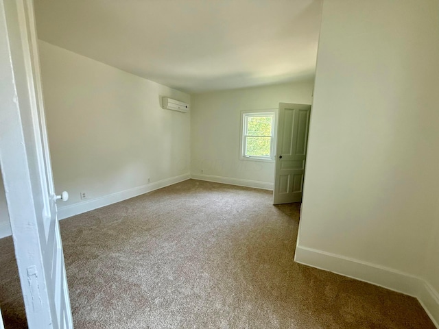 85 Blymer St, Delaware, OH 43015 - carpeted spare room with a wall mounted air conditioner and baseboards