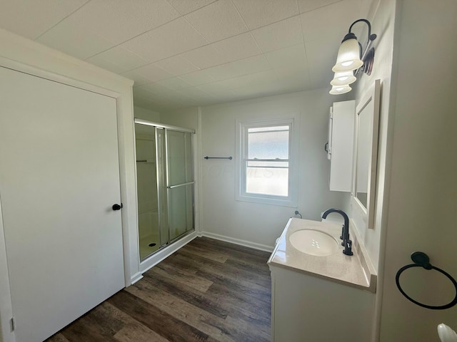 85 Blymer St, Delaware, OH 43015 - bathroom with vanity, a shower stall, and wood finished floors