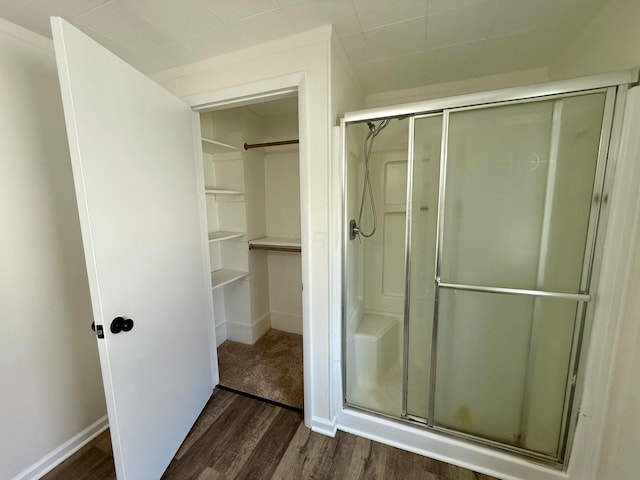 85 Blymer St, Delaware, OH 43015 - full bath with wood finished floors, a shower stall, and a walk in closet