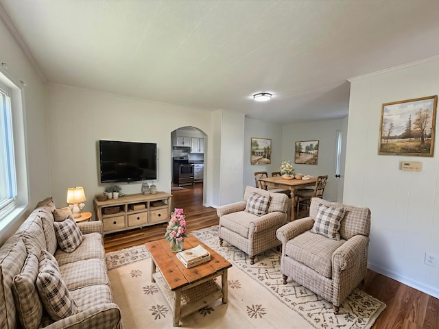 85 Blymer St, Delaware, OH 43015 - living area with arched walkways, wood finished floors, and ornamental molding