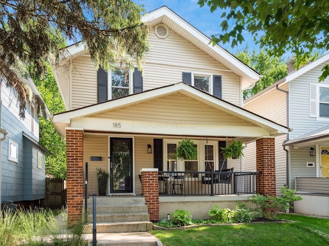 185 Frebis Ave, Columbus, OH 43206 - american foursquare style home with a porch and brick siding