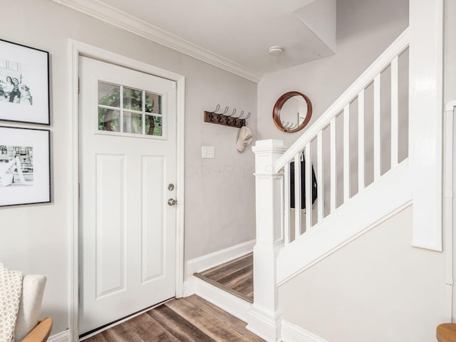 185 Frebis Ave, Columbus, OH 43206 - foyer entrance featuring wood finished floors, stairway, and ornamental molding