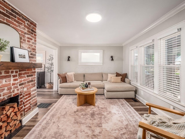 185 Frebis Ave, Columbus, OH 43206 - living area with a fireplace, ornamental molding, and dark wood-style flooring