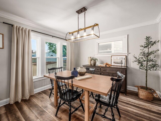 185 Frebis Ave, Columbus, OH 43206 - dining space featuring crown molding and dark wood-style floors