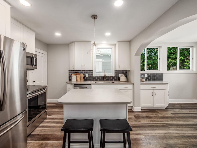 185 Frebis Ave, Columbus, OH 43206 - kitchen with appliances with stainless steel finishes, a kitchen breakfast bar, backsplash, light countertops, and recessed lighting