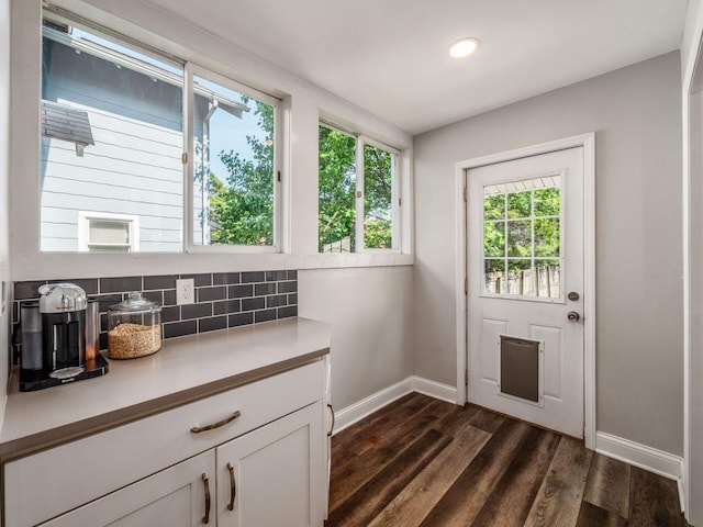 185 Frebis Ave, Columbus, OH 43206 - doorway to outside featuring dark wood-type flooring and recessed lighting