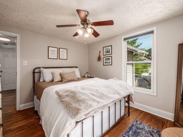 185 Frebis Ave, Columbus, OH 43206 - bedroom featuring wood finished floors, a textured ceiling, and a ceiling fan