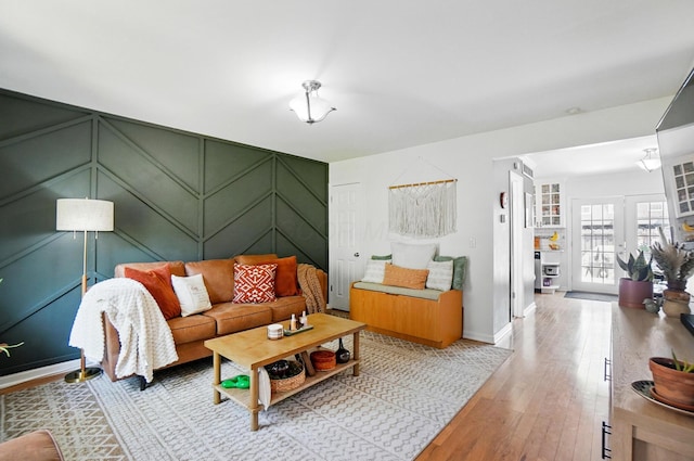 602 Dlyn St Unit H8, Columbus, OH 43228 - living area with light wood-type flooring and a decorative wall