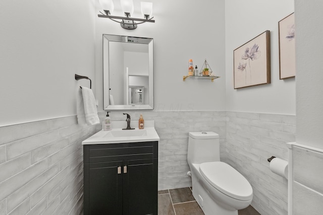 5431 Goose Falls Dr, Dublin, OH 43016 - bathroom with vanity, tile walls, and wainscoting