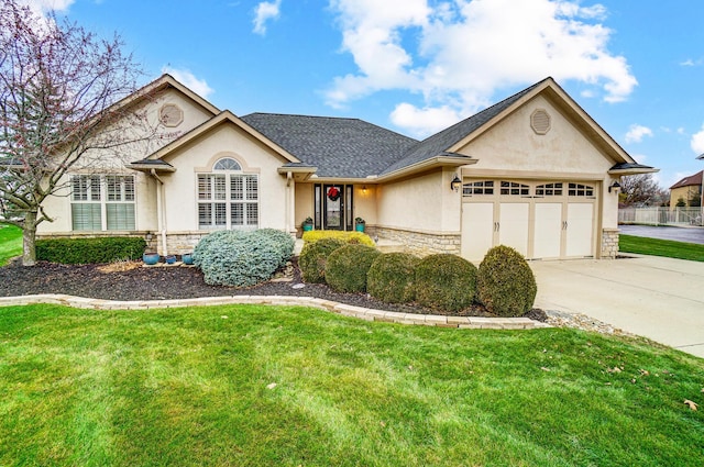 2474 Marthas Wood, Grove City, OH 43123 - ranch-style house featuring stucco siding, stone siding, an attached garage, concrete driveway, and a front yard