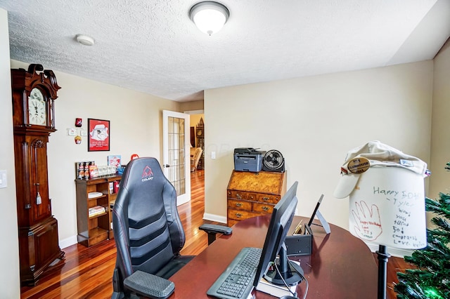2474 Marthas Wood, Grove City, OH 43123 - office featuring wood finished floors, a textured ceiling, and french doors
