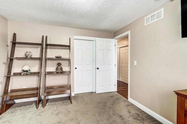 2474 Marthas Wood, Grove City, OH 43123 - bedroom featuring a closet, carpet, and a textured ceiling