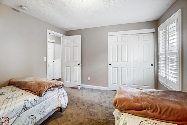 2474 Marthas Wood, Grove City, OH 43123 - carpeted bedroom featuring a closet and a textured ceiling