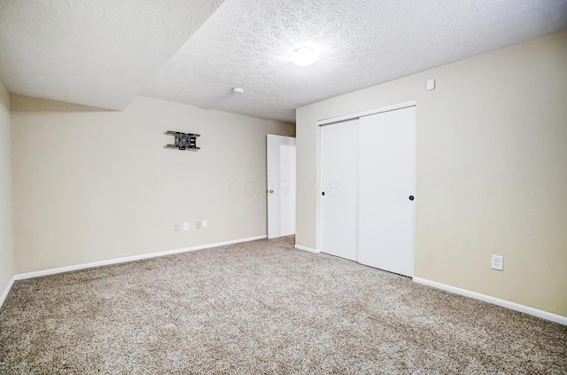 2474 Marthas Wood, Grove City, OH 43123 - unfurnished bedroom featuring carpet floors, a closet, and a textured ceiling