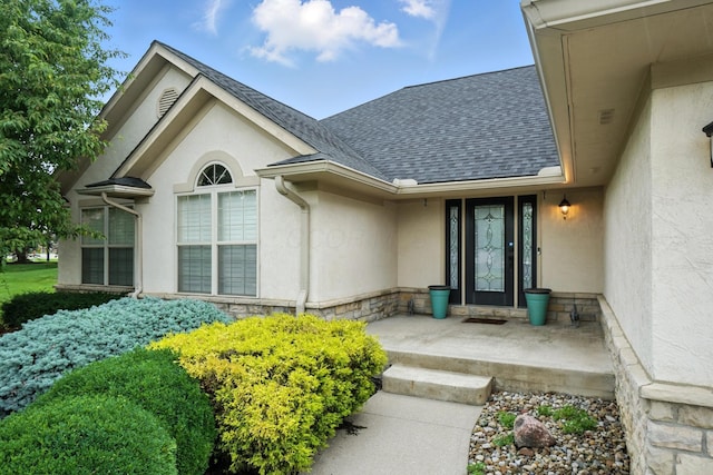 2474 Marthas Wood, Grove City, OH 43123 - doorway to property featuring stucco siding, a shingled roof, and stone siding