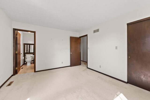 12475 Oak Dr, Orient, OH 43146 - unfurnished bedroom featuring light carpet and ensuite bathroom