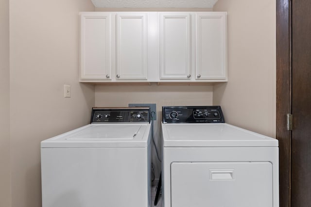 12475 Oak Dr, Orient, OH 43146 - washroom featuring washing machine and clothes dryer and cabinet space