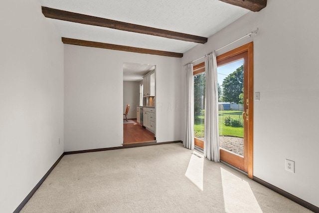 12475 Oak Dr, Orient, OH 43146 - carpeted spare room with beamed ceiling and a textured ceiling
