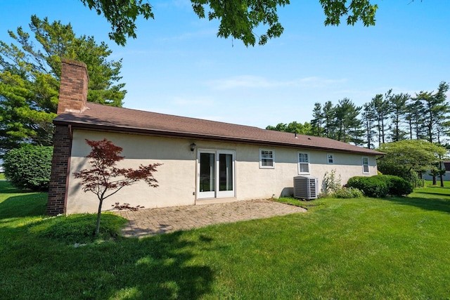 12475 Oak Dr, Orient, OH 43146 - back of house with stucco siding, a yard, a patio area, and a chimney