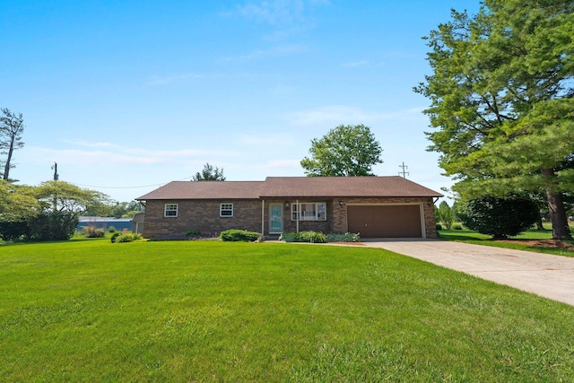 12475 Oak Dr, Orient, OH 43146 - single story home featuring a garage, concrete driveway, brick siding, and a front lawn