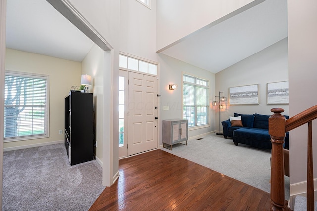 4401 Kathryns Way, Hilliard, OH 43026 - carpeted foyer entrance featuring wood finished floors and high vaulted ceiling