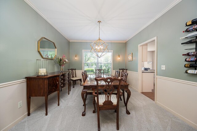4401 Kathryns Way, Hilliard, OH 43026 - dining room featuring a chandelier, light carpet, crown molding, and wainscoting