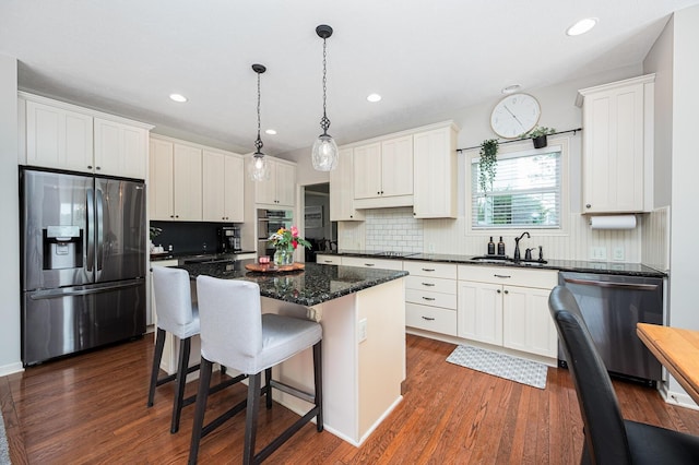 4401 Kathryns Way, Hilliard, OH 43026 - kitchen with stainless steel appliances, a center island, dark wood finished floors, and recessed lighting