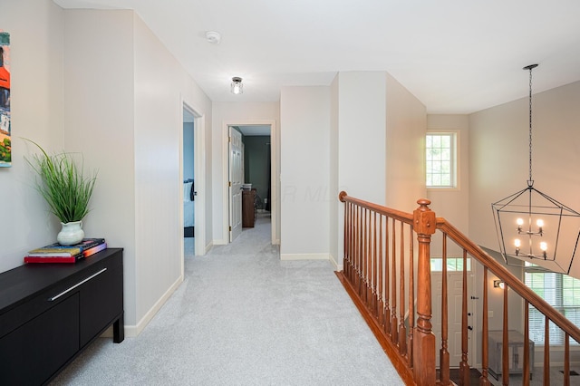 4401 Kathryns Way, Hilliard, OH 43026 - corridor featuring a chandelier, light carpet, and an upstairs landing